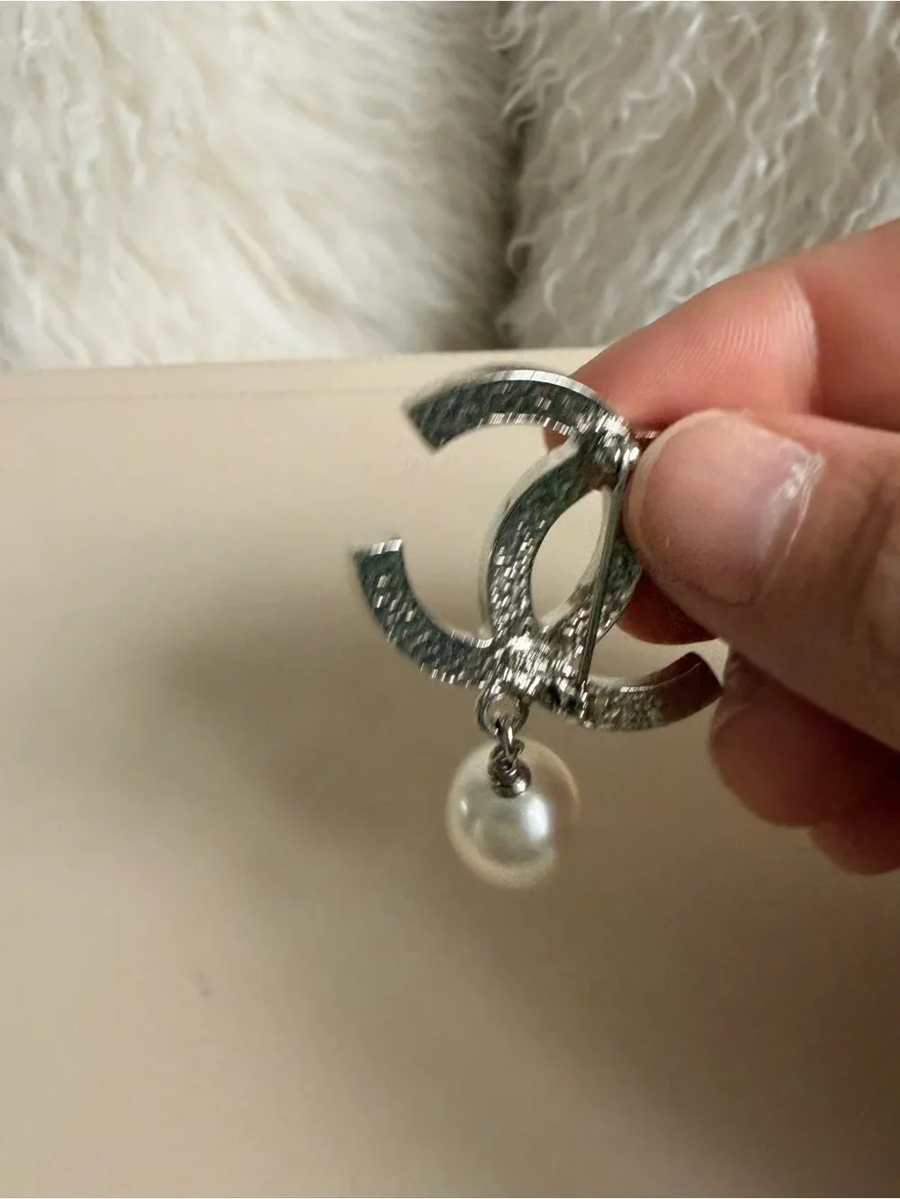CHANEL brooch showcasing